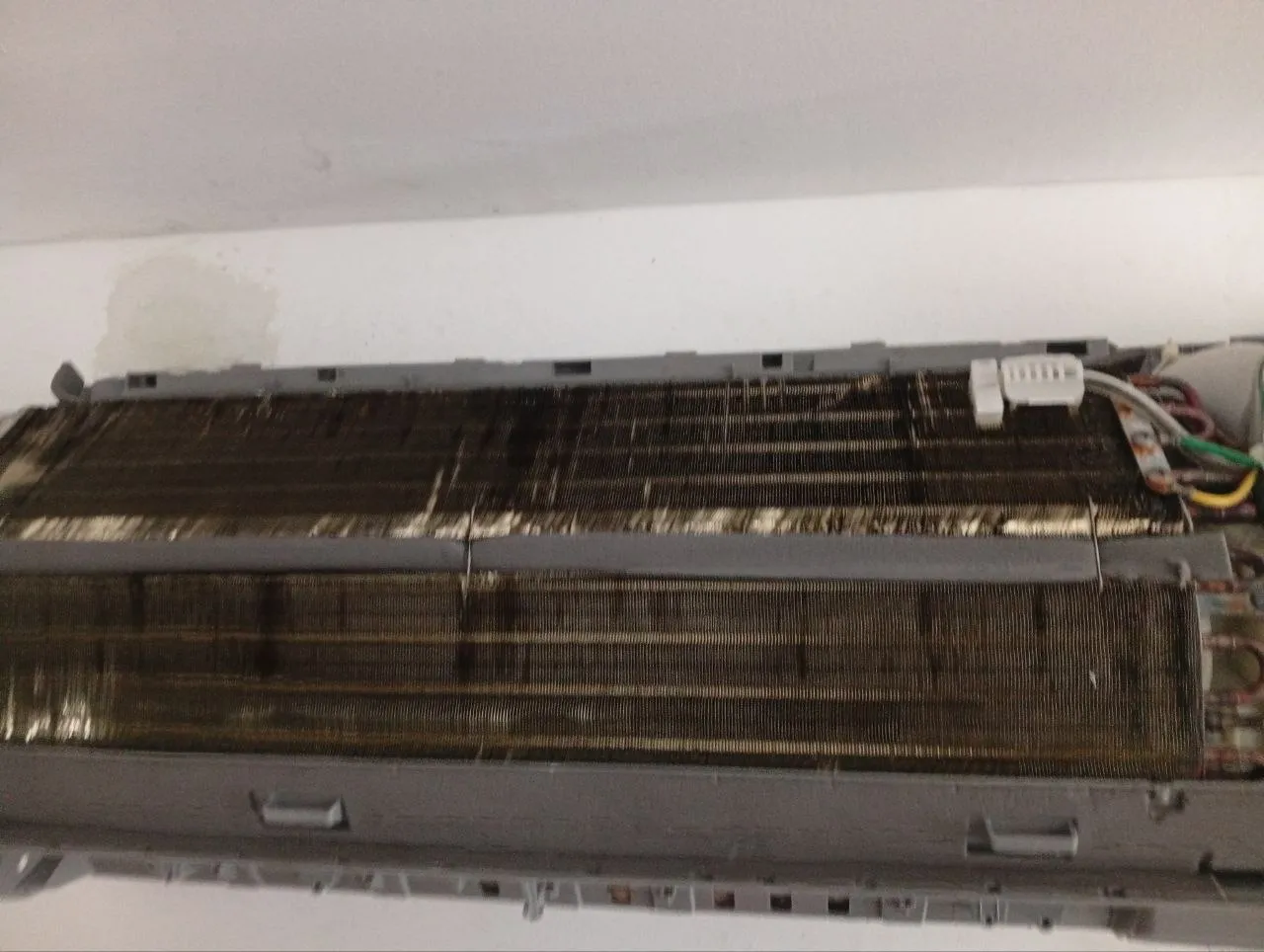 Dirty AC evaporator coil before deep cleaning in Bali